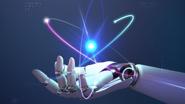 Roboterhand mit Atomkern In einer Roboterhand schwebt eine Art Atom-Hologramm